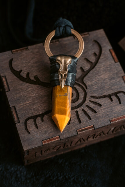 Tiger's Eye Kundalini Raven pendant with brass raven skull on supple leather. A powerful talisman for spiritual growth and protection.