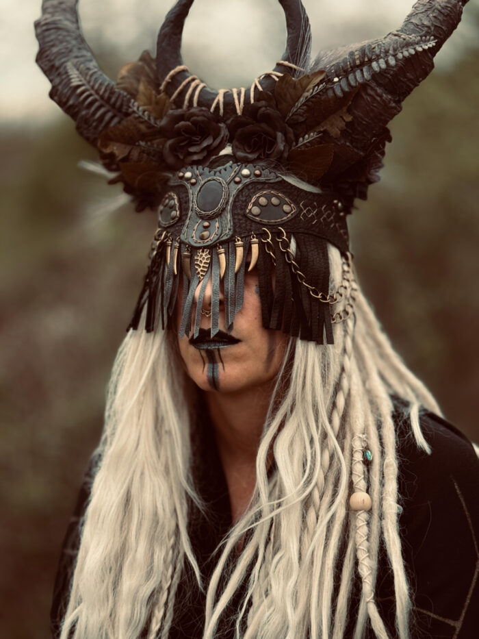 Mini Tuva Tribe Face Mask & Witchy Belt - A shamanic pagan ritual trance mask that doubles as a witchy belt. Crafted with intricate details and supple leather, this versatile accessory exudes mystical charm and ancient wisdom. Horn accents not included.